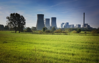 a nuclear plant behind an open field