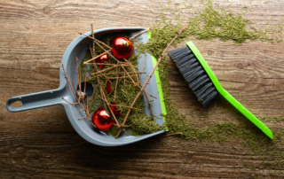 Sweeping up dried twigs and broken ornaments