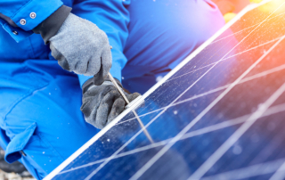 Professional electrician worker installing solar panels