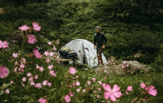 Person camping in the woods