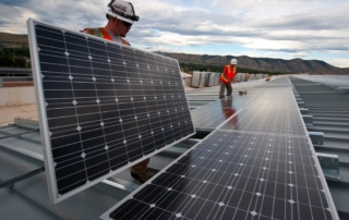 People installing solar panels