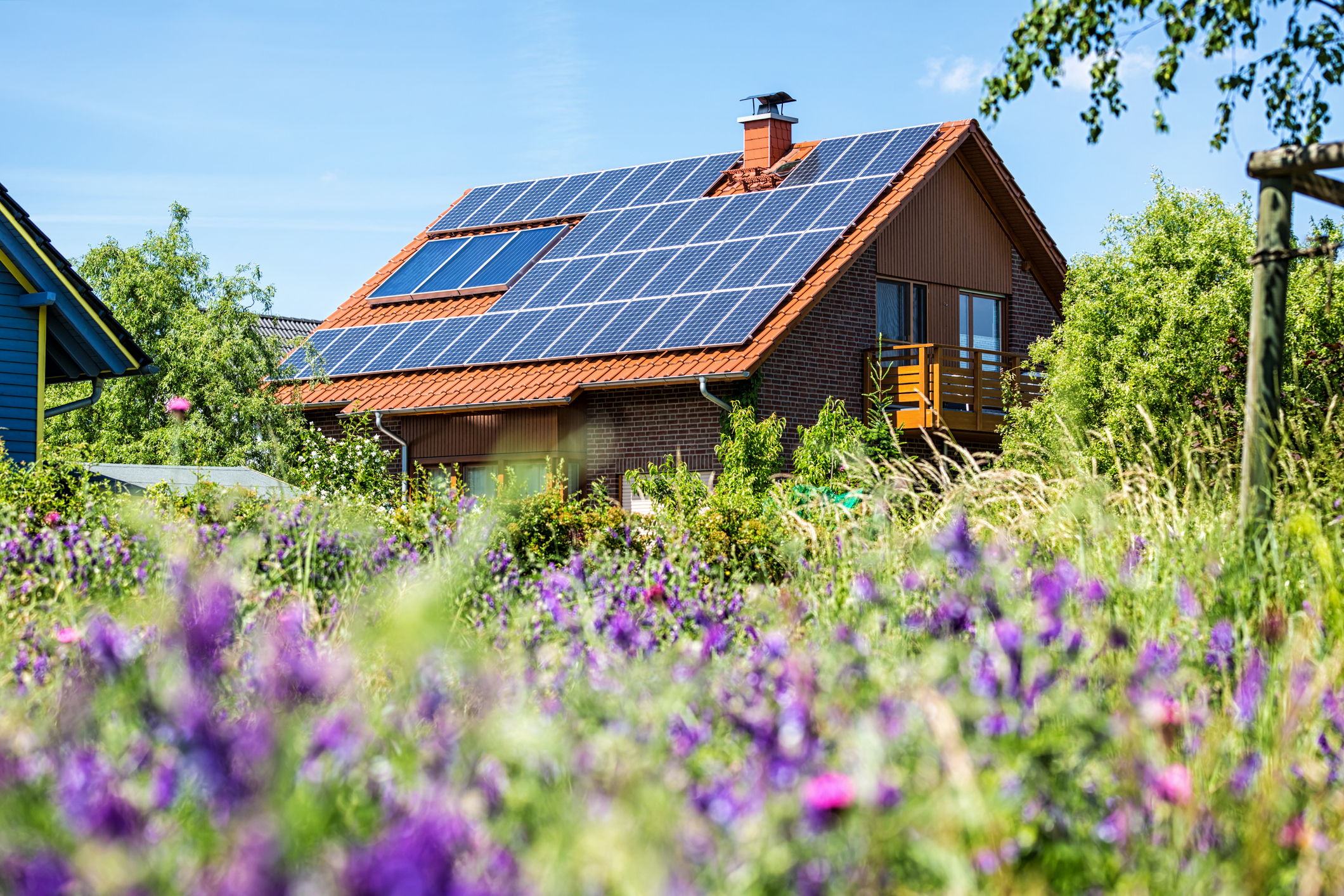 House with solar panels in summertime